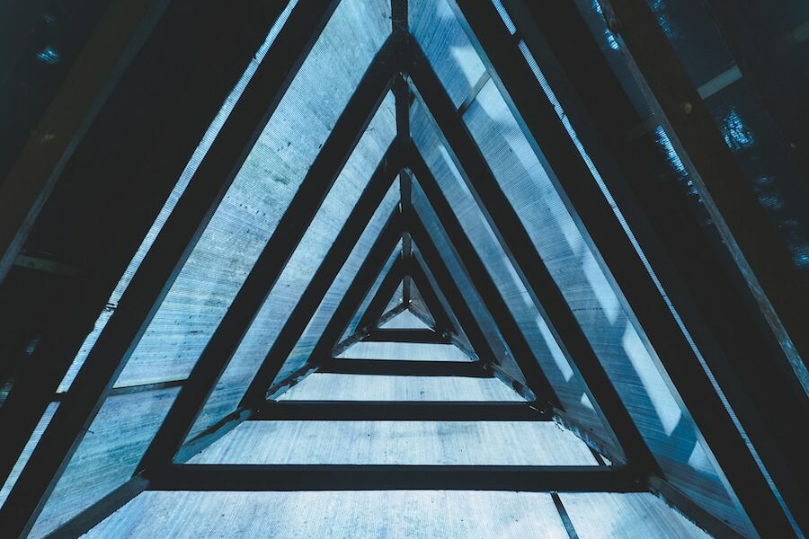 a group of triangular shaped windows in a building